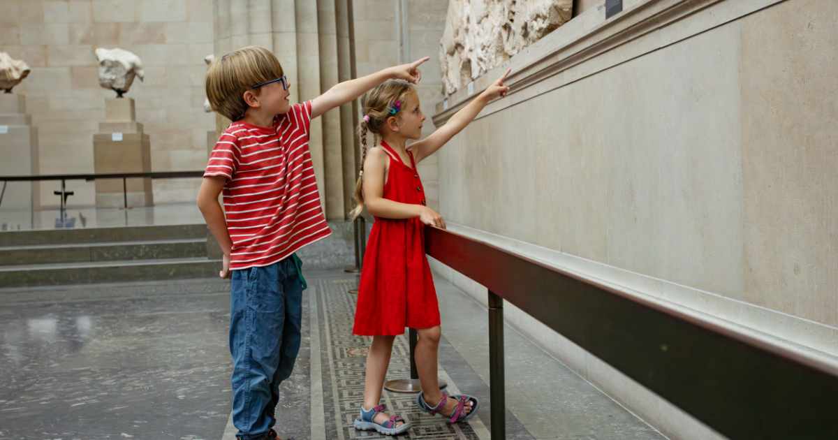 Museum Slider Photo of two young children in a museum pointing at an exhibit